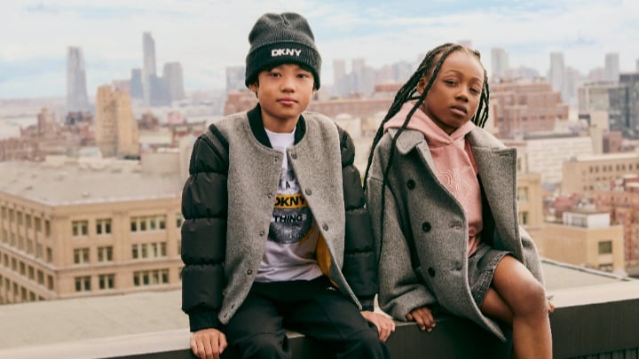 Image of a boy and girl in DKNY outfits